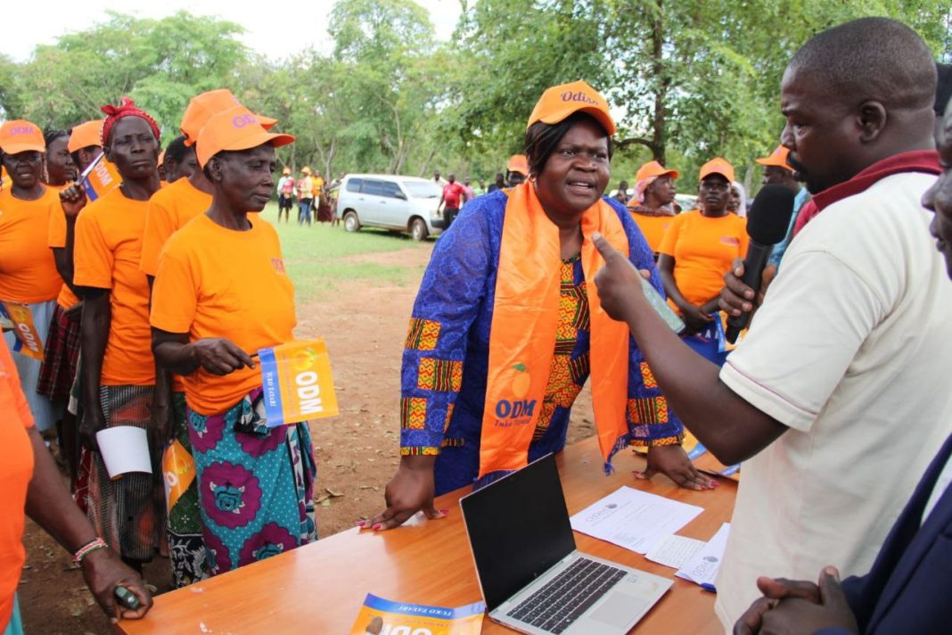 ODM Gears Up for 2027 Presidential Race with Renewed Strategies and Grassroots Reforms ODM to election officials verifies details of the party national chairperson Gladys Wanga before participating in the grassroots polls at Alara Korayo primary school in Kochia,Rangwe constituency on November 27,2024